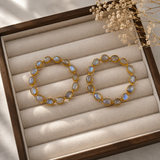 Luminous Orbit Statement Hoops – Gold Plated Rainbow Moonstone Garland Hoops
